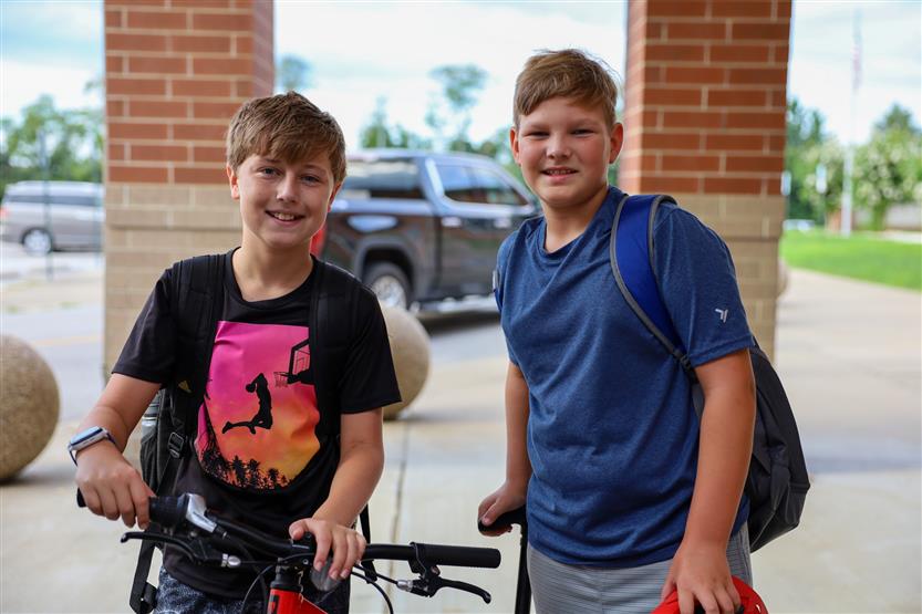 Two boys smile